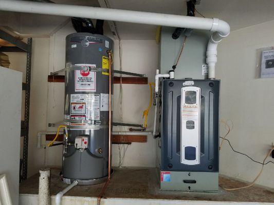 Upflow High Efficiency 95% Furnace and Ac with Media filter. New Rheem High Efficiency Water Heater.