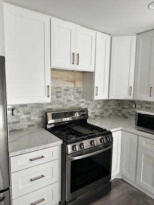 They installed both our countertop and backsplash (we had them leave the top section bare for the oven hood)