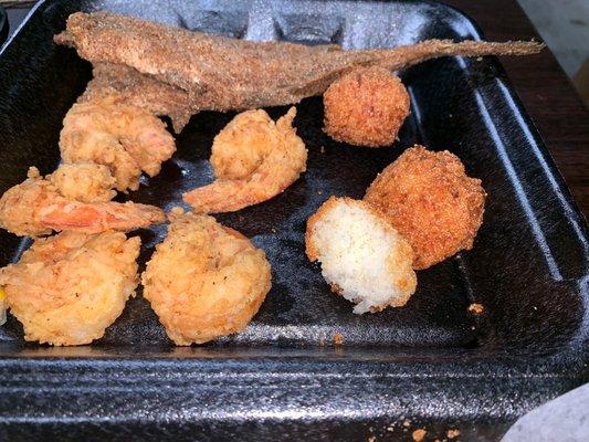 Perfectly fried, lightly-breaded shrimp and light and fluffy hush puppies with a crisp exterior.