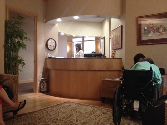 View of the receptionist desk from the waiting area