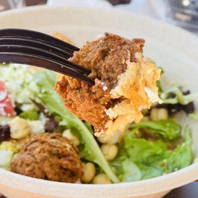 Falafel salad with couscous, greens and feta hummus.