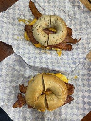 Breakfast sandwiches, one on a rye bagel (top) and one on a jalapeño bagel