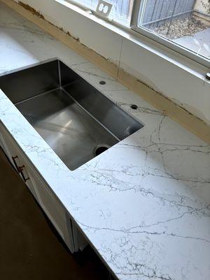 We purchased this Calcutta Viraldi quartz countertop from Balboa Flooring & Kitchen