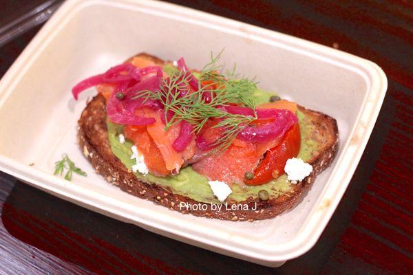 Seasonal Salmon Avocado Toast ($8.65) - 9-grain bread, avocado, smoked salmon, goat cheese, roasted tomatoes, pickled oinions, capers, dill