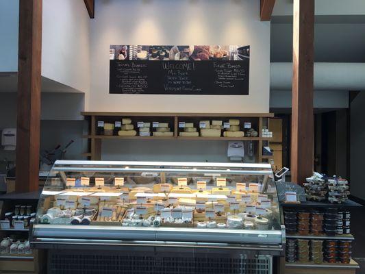 Cut to order, full service Vermont cheese case.  We love to offer samples!