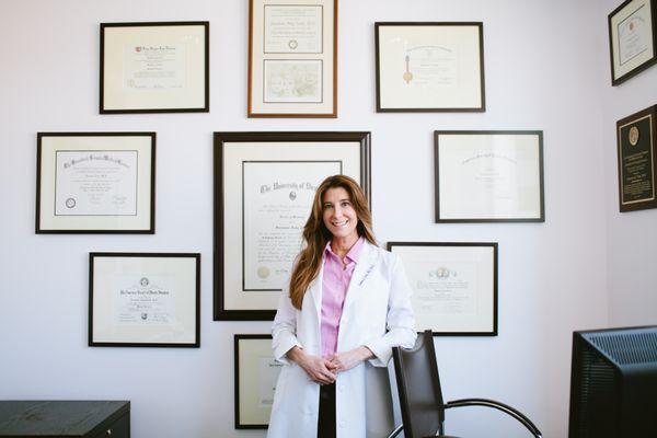 Suzanne Trott (Lipo Queen) with her many degrees/certifications. She is double board certified.