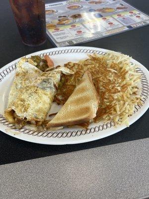 Fiesta Omelette (hold the ham and yoke) So basically it's a veggie omelette with hash browns