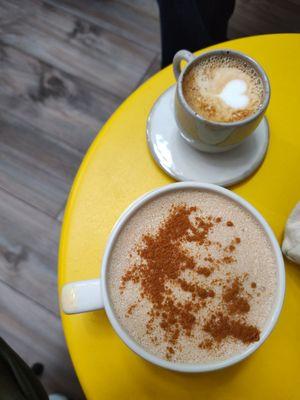 Chai latte with cinnamon and a cortado