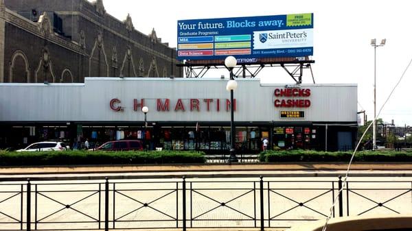 View of the storefront from across the street. It's located across from the Journal Square Transportation Center/PATH.