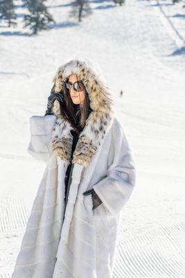 White hooded mink coat trimmed with lynx