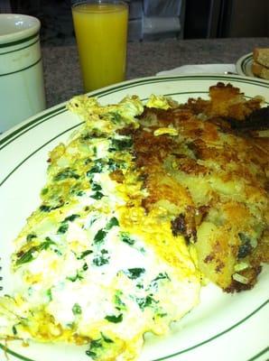 Greek omelette with home frieds.