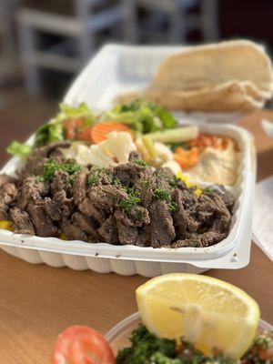 Plenty of steak in the beef shawarma plate, plus a stack of healthy veggies and some delicious hummus