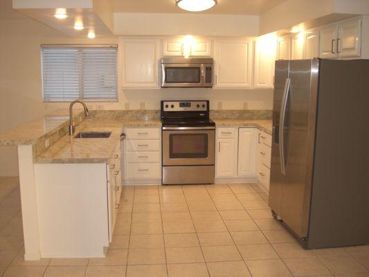 after photo fantastic work completed by delta finishes and Julio's team! modern white bright kitchen thanks to delta finishes!