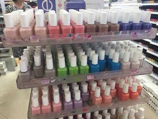 racks of Essie polishes