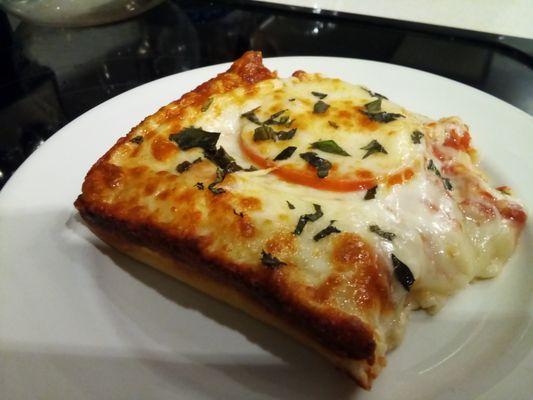 Sicilian style pizza. Fresh tomato, mozzarella, basil. Super Tasty!