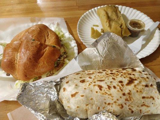 A sandwich and rather large burrito. I think the other item is a tamale (?).