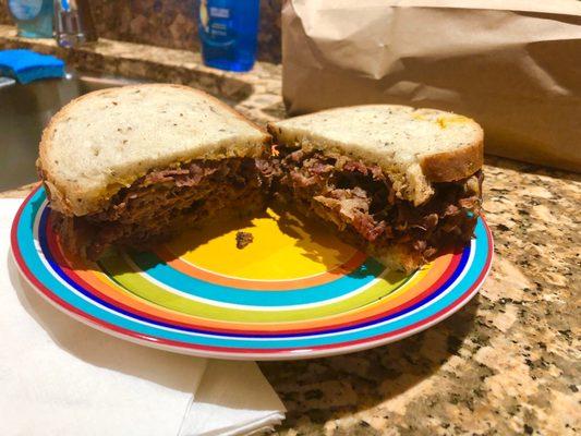 Pastrami on rye with yellow mustard