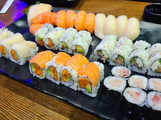 AYCE menu (top row L-R: escolar & salmon sashimi, salmon & escolar nigiri, Philly, smoked salmon, snow white, crazy salmon, yellowtail)