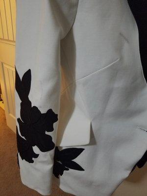 Brand new never been worn White House Black Marker blazer damaged by Dacula Cleaners.