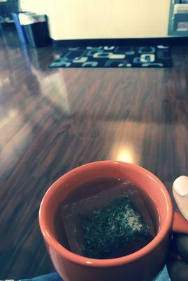 Enjoying a warm cup of dandelion tea while my husband gets his massage.