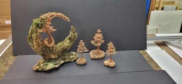 group of copper wire sculptures