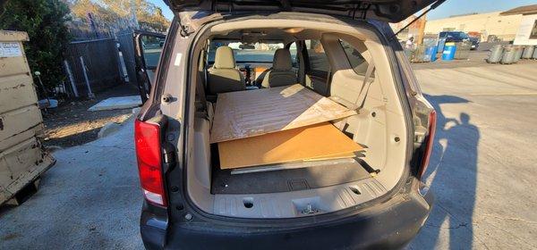 Car empty of cardboard boxes