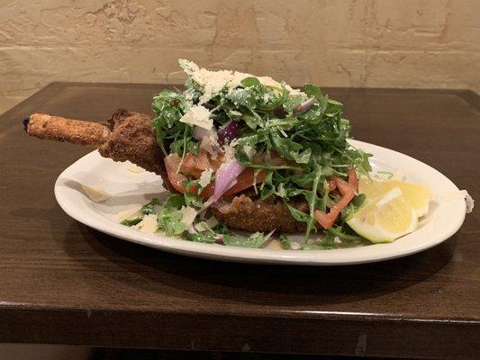 Veal Milanese topped with baby arugula, sliced tomatoes, red onions and shaved pecorino cheese! Delicious