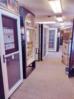 A showroom featuring Andersen window and door displays, with various styles and designs to help customers choose the perfect ...