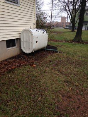 Oil tank at one of the properties that Olson's AC and Heating converted to gas