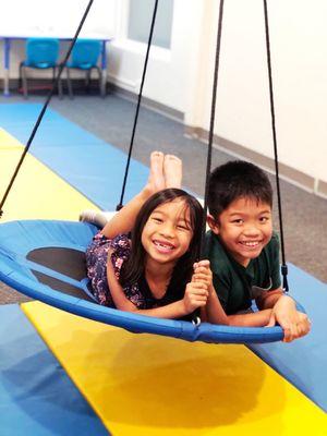 Kids having fun on the sensory integration equipment.