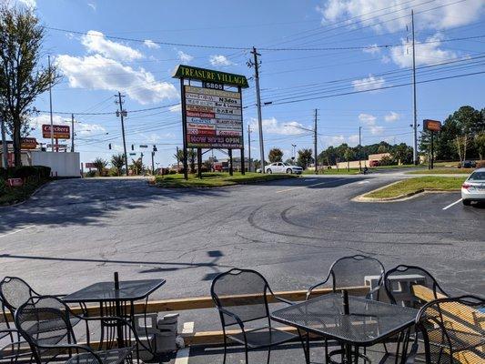 Outside. Parking lot. View from patio. N3dos is located in Treasure Village in the former Shooter Alley building.