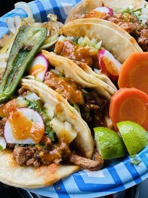 Al Pastor tacos with hot sauce