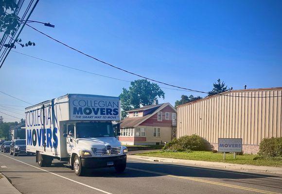 Collegian Movers Moving Truck driving past its 482 Naugatuck Ave, Milford, CT 06460 location.