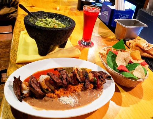 Traditional Steak and Shrimp Alambre with Guacamole. Come dine with us, you will enjoy it. Be one of us. Be different.