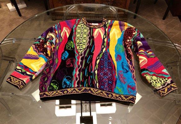 1995 Coogi sweater. They blocked the sleeves 1.5 inches and the material doesn't appear stretched.