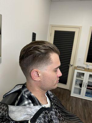 Taper fade, 1/2 over the ears, skin taper side burns and nape.