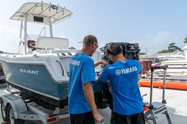 Yamaha Marine Maintenance Certification Program students put their skills to work by installing an engine on a Chapman fleet boat.