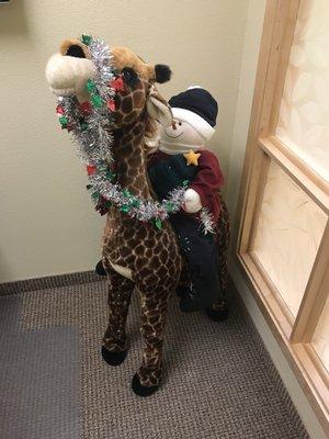 Jeffery the giraffe is having some fun this holiday season!