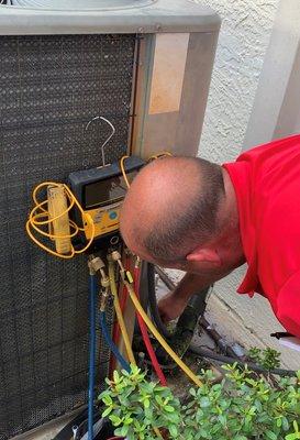 Checking refrigerant pressure during routine maintenance.