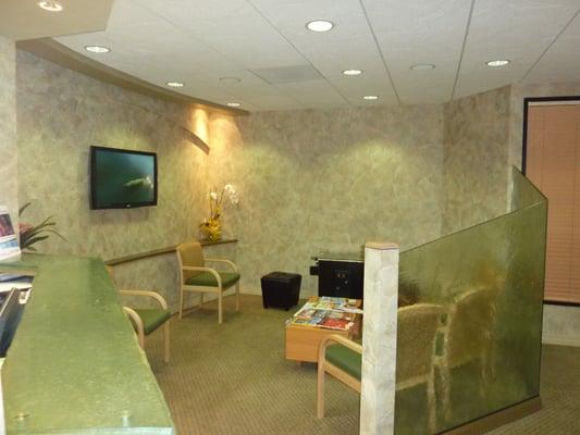 Our comfortable patient area has HD TV and arcade games