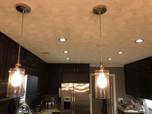 4" recessed lighting and pendant lights installation. Customer previously only had a 4 ft. fluorescent light fixture.