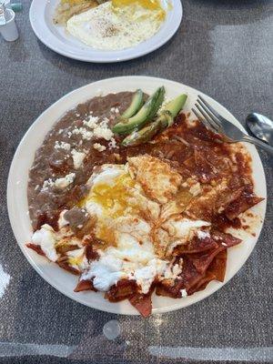 Chilaquiles in red sauce (after I'd already started digging in).