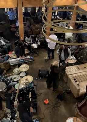 View from private room upstairs looking down at the band performing.