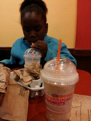 My Bby boy enjoying an iced caramel lata