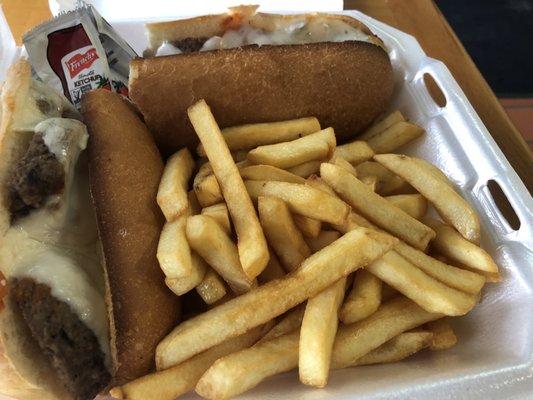 Meatball sub cut in half and fries