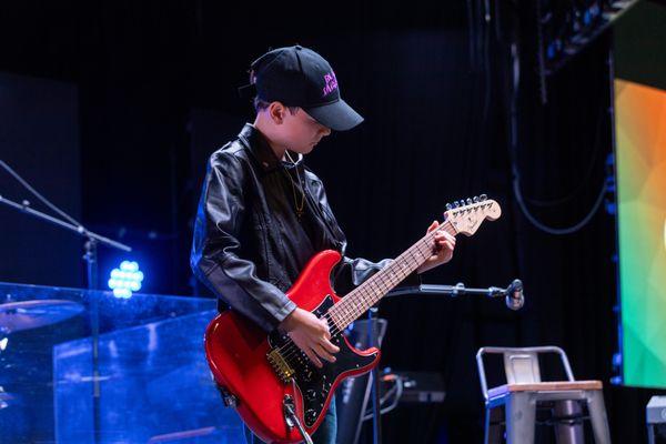 One of our amazing guitar students performing at our semi-annual Showcases!