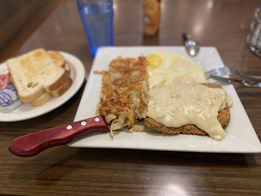 Country-fried steak with sausage gravy