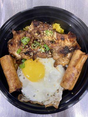 Chicken Adobo Selog ( rice bowl ) Grilled boneless thighs over adobo sauce with fried egg, Java rice and 2 pork lumpias ( Shanghai )