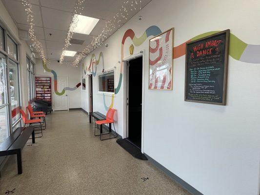 High Impact Dance studio lobby. Each dance classroom has a viewing window so parents can see their dancers from the lobby.