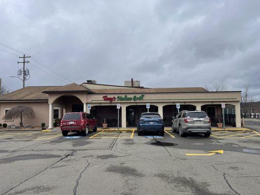 Front of restaurant. No sign by the road would miss it unless you're looking for it. It's nice inside though!